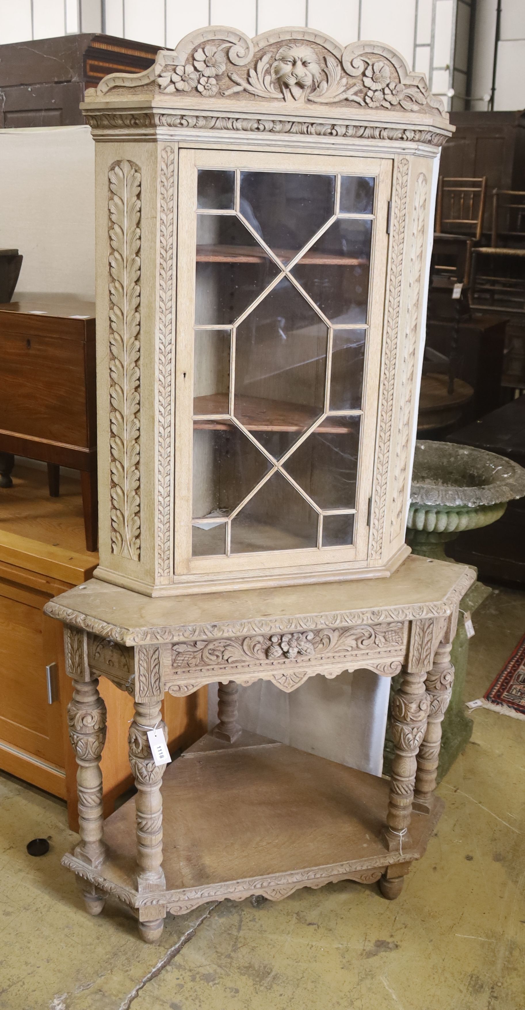 A Flemish bleached oak corner cabinet, width 98cm, depth 70cm, height 190cm